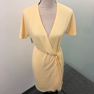 NWT Babaton pale yellow wrap dress.